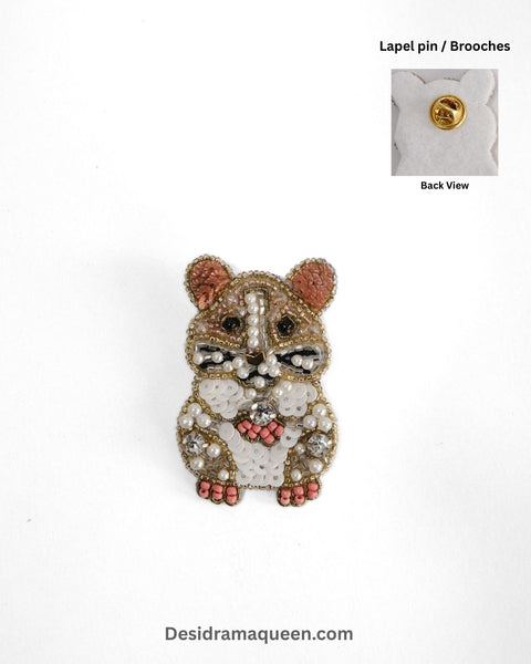 Handcrafted hamster brooch with beads, pearls, and sequins in brown, white, and pink tones, unique animal lapel pin.