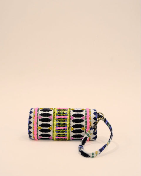 Embroidered sunglass pouch with geometric tribal design in black, white, pink, and green, handmade eyewear cover with wrist strap.