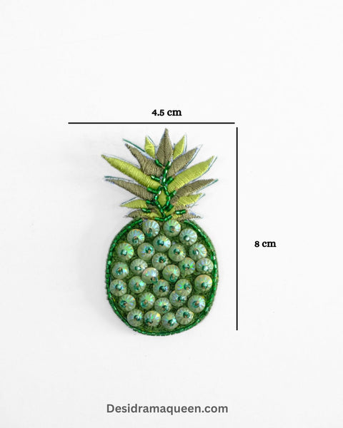 Tropical pineapple brooch with green sequin leaves and golden bead detailing, handmade fruit lapel pin for jackets, dresses, and bags