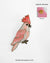 Handmade pink cockatoo bird brooch with sequins and bead embroidery, unique lapel pin accessory.