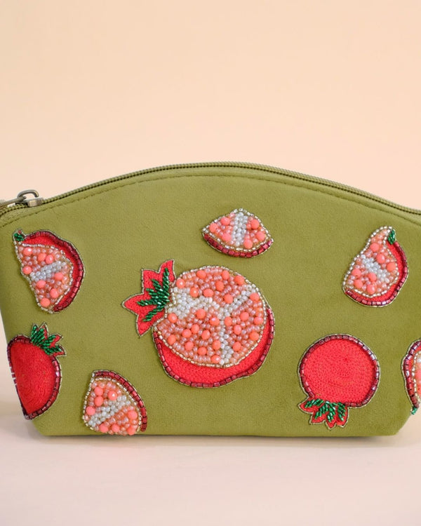 Olive green pouch featuring embroidered pomegranate motifs with beadwork, maroon tassel zipper, handmade cosmetic bag.