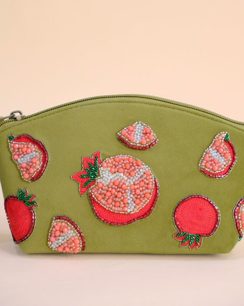 Olive green pouch featuring embroidered pomegranate motifs with beadwork, maroon tassel zipper, handmade cosmetic bag.