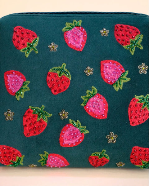 Green pouch featuring embroidered red and pink strawberries with tassel zipper, handmade cosmetic and travel bag.