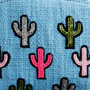 Colorful cactus patches on a blue background