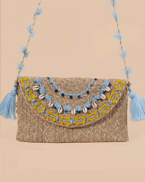 Woven handbag with decorative elements on a beige background