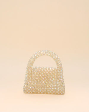 Compact rainbow bead handbag with shimmering finish, lightweight mini tote for women.