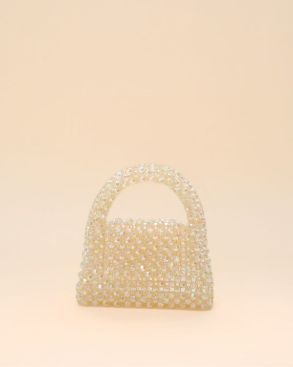 Compact rainbow bead handbag with shimmering finish, lightweight mini tote for women.