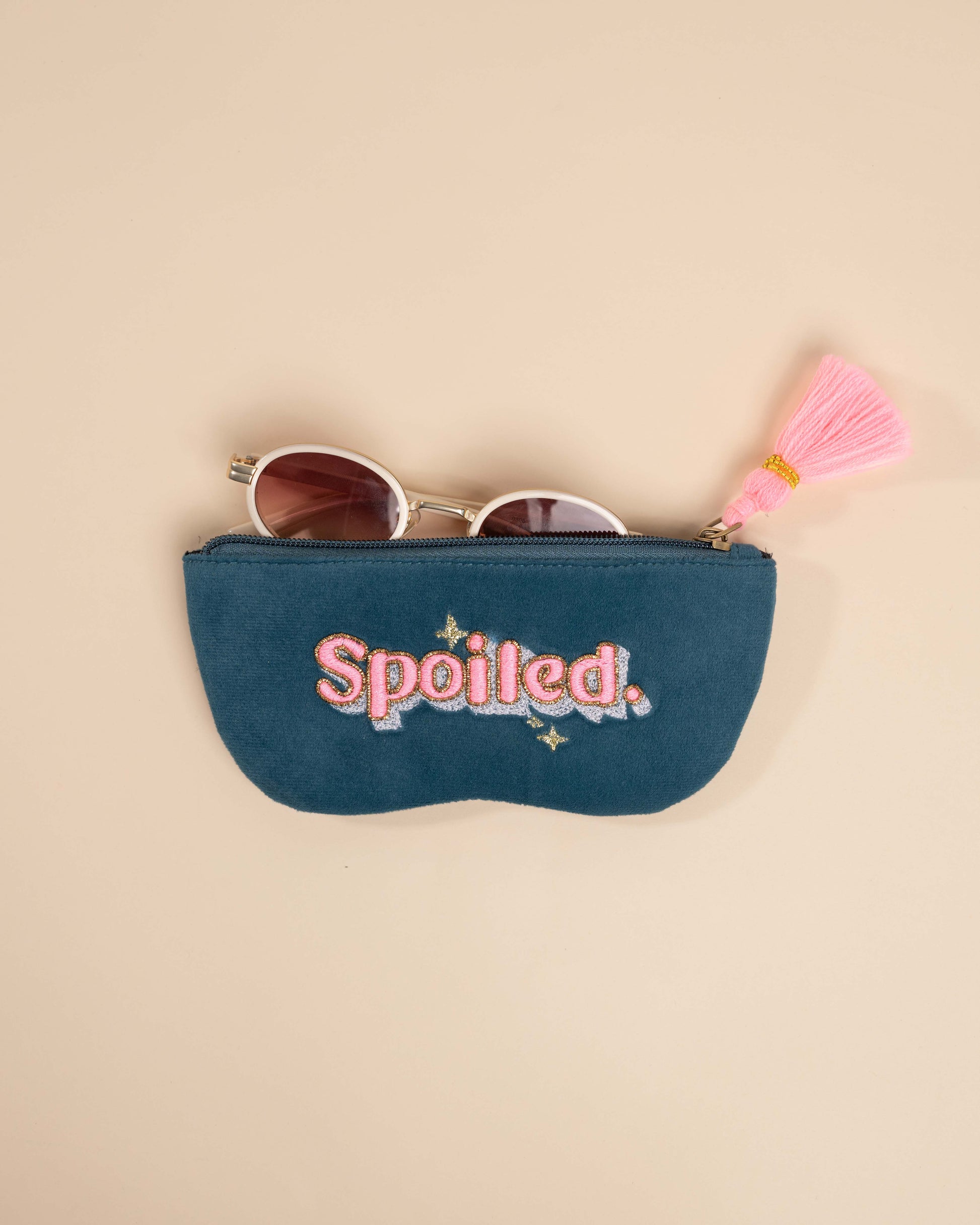 Teal sunglass cover with nakshi aari embroidery, neon tassel, and golden bead accents