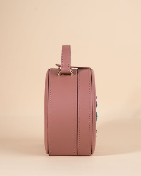 Stylish peach box sling with evil eye symbol, detailed with hand embroidery and gold fittings