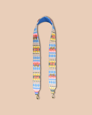 Colorful strap with geometric pattern on a beige background