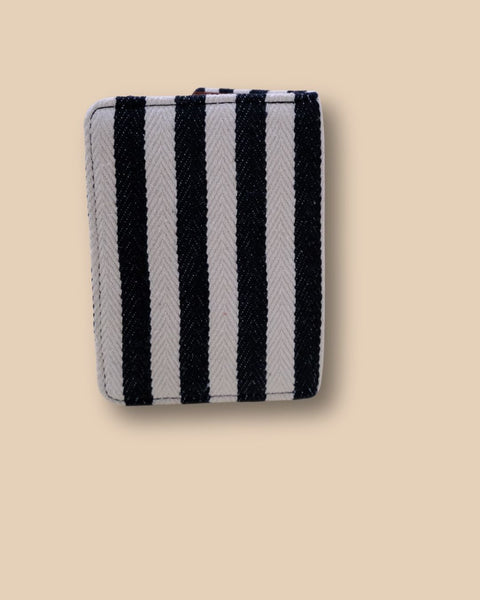 Personalized fabric passport cover featuring stripes and airplane motif.