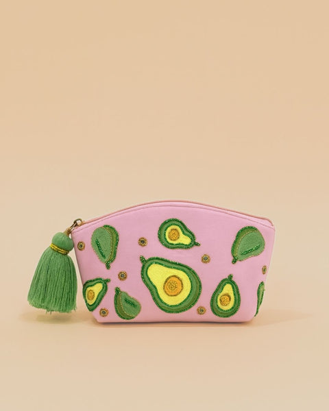 Pink makeup pouch with embroidered avocado designs and green tassel zipper, handmade cosmetic bag for travel and daily use.