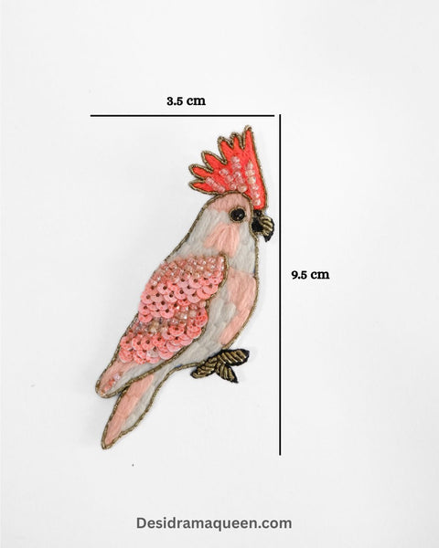 Handmade cockatoo brooch in pink and white with embroidery