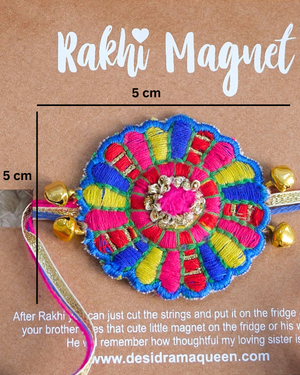 Close-up of Bandhan Chakri embroidered rakhi magnet on display card, showcasing handcrafted design and reusable keepsake fridge magnet.