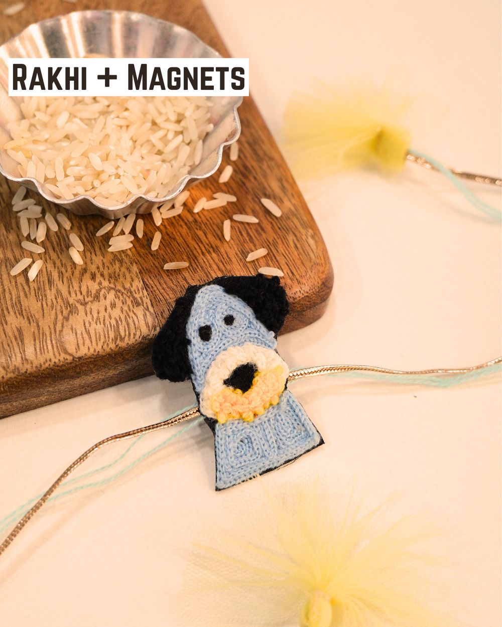 Beagle Dog embroidered rakhi magnet placed beside a bowl of rice, styled for a festive Raksha Bandhan celebration.