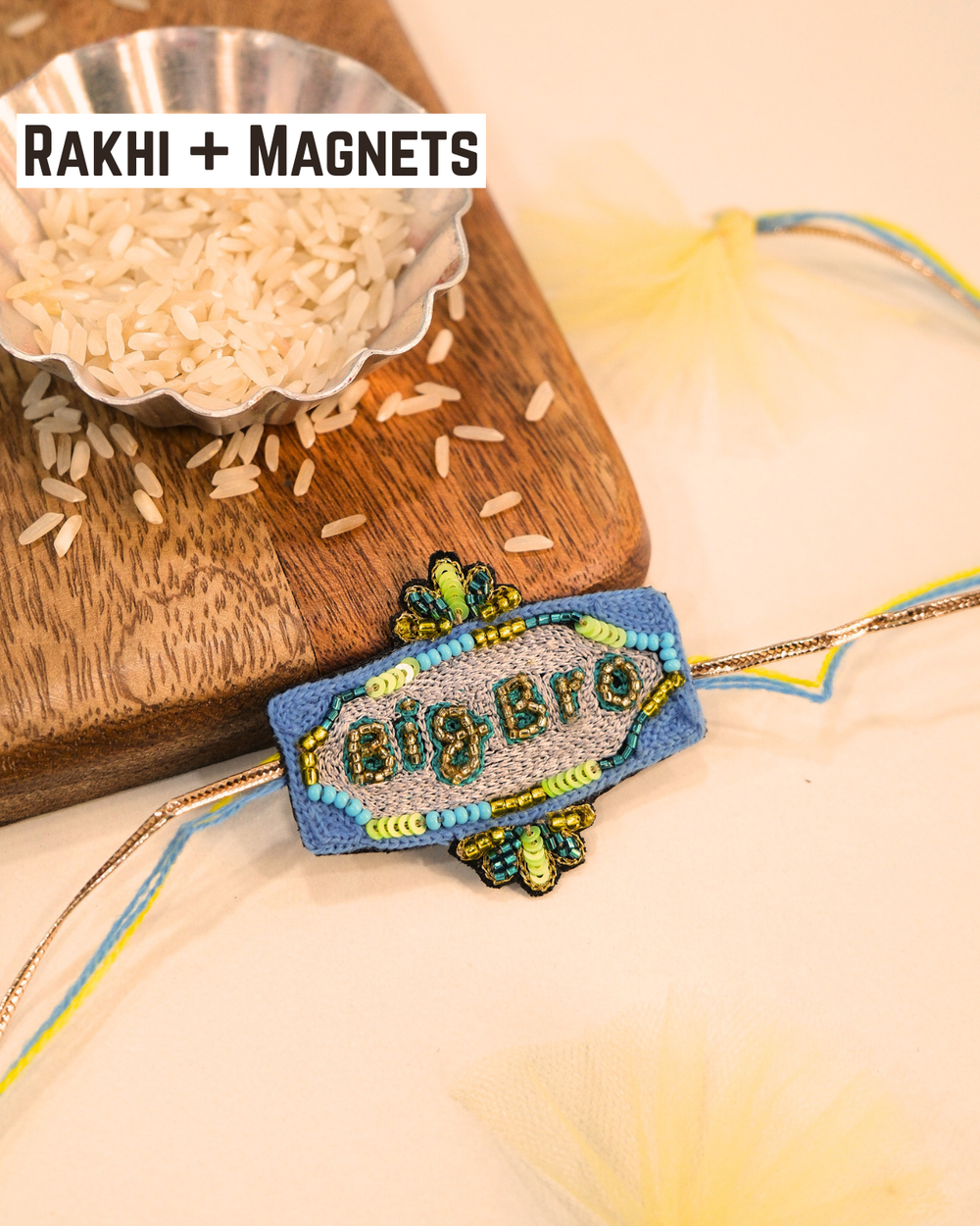 Big Bro embroidered rakhi with glitter lettering placed beside a bowl of rice for a festive Raksha Bandhan celebration.