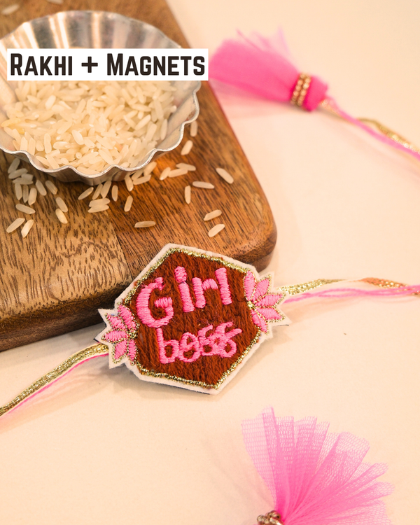 Bold "Girl Boss" Rakhi magnet displayed with pink threads and tassels, celebrating confidence, ambition, and festive sibling love.