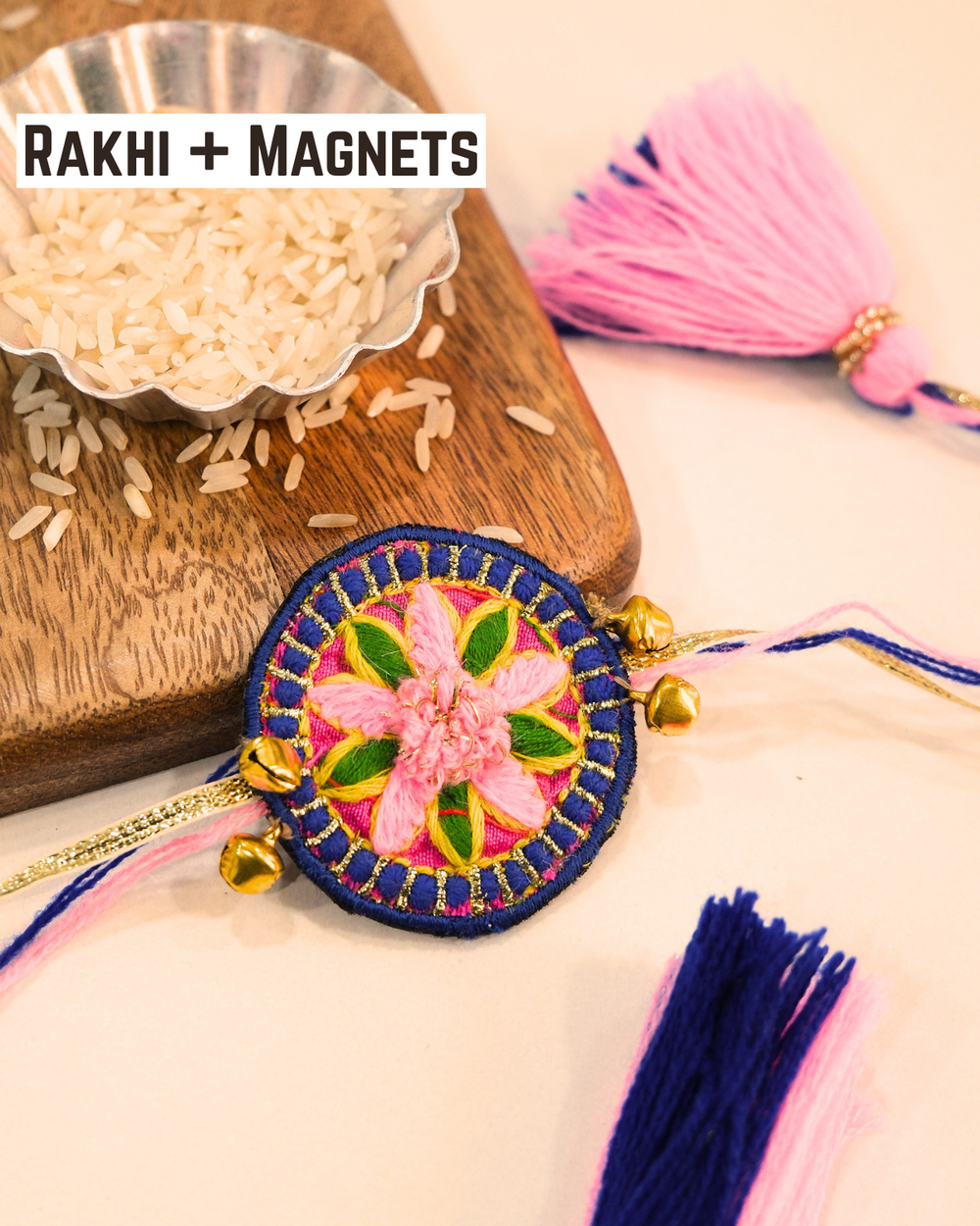 Handcrafted Gulabi Mandala Rakhi magnet displayed with colorful threads and tassels, adding a vibrant festive touch to Raksha Bandhan.