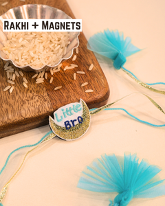 Little Bro embroidered rakhi with glitter crescent moon magnet placed beside a bowl of rice for Raksha Bandhan celebration.