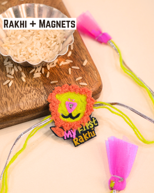 Handcrafted my first Rakhi magnet displayed on a wooden board with colorful Rakhi threads, perfect keepsake for newborns and toddlers.