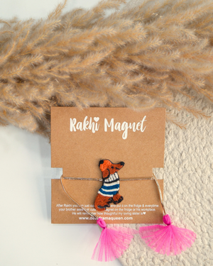 Weiner Dog embroidered rakhi magnet displayed on a branded gift card with pink tassels, perfect for Raksha Bandhan gifting.