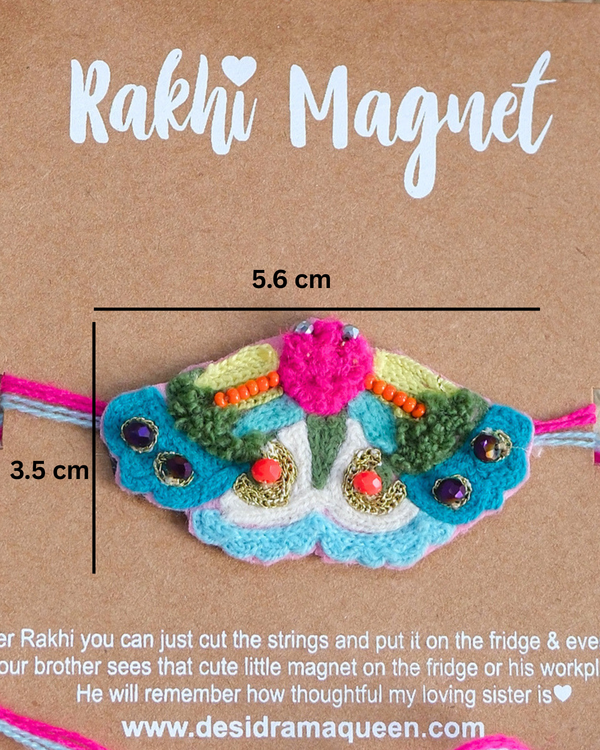 Close-up of Butterfly embroidered rakhi magnet on display card, showcasing handcrafted design and reusable keepsake fridge magnet.