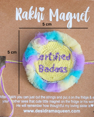 Close-up of Certified Badass embroidered rakhi magnet on display card, showcasing handcrafted design and reusable keepsake fridge magnet.