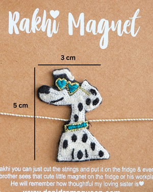 Close-up of Cool Dog embroidered rakhi magnet on display card, showcasing handcrafted design and reusable keepsake fridge magnet.
