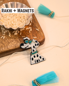 Cool Dog embroidered rakhi magnet placed beside a bowl of rice, styled for a festive Raksha Bandhan celebration.