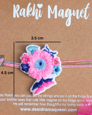 Packaged Evil Eye Floral Rakhi magnet on a wooden backdrop, highlighting a meaningful handcrafted Raksha Bandhan gift with protective symbolism.