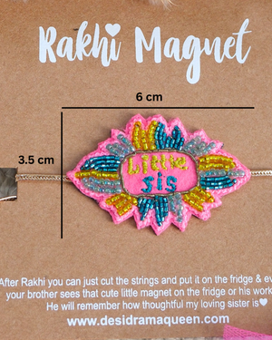 Close-up of Little Sis embroidered rakhi magnet on display card, showcasing handcrafted design and reusable keepsake fridge magnet.