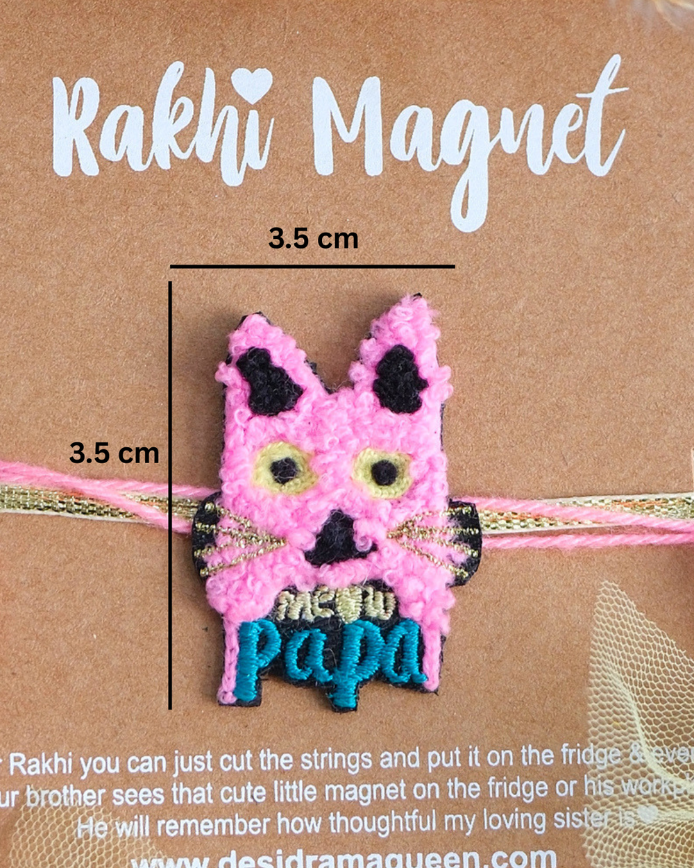 Meaw Papa embroidered rakhi magnet displayed on a branded gift card with yellow tassels, perfect for Raksha Bandhan gifting.