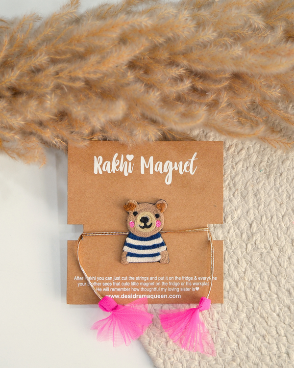 Panda embroidered rakhi magnet displayed on a branded gift card with pink tassels, perfect for Raksha Bandhan gifting.