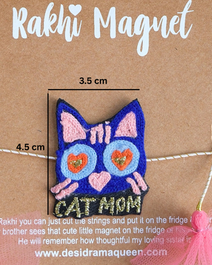 Close-up of Cat Mom embroidered rakhi magnet on display card, showcasing handcrafted design and reusable keepsake fridge magnet.