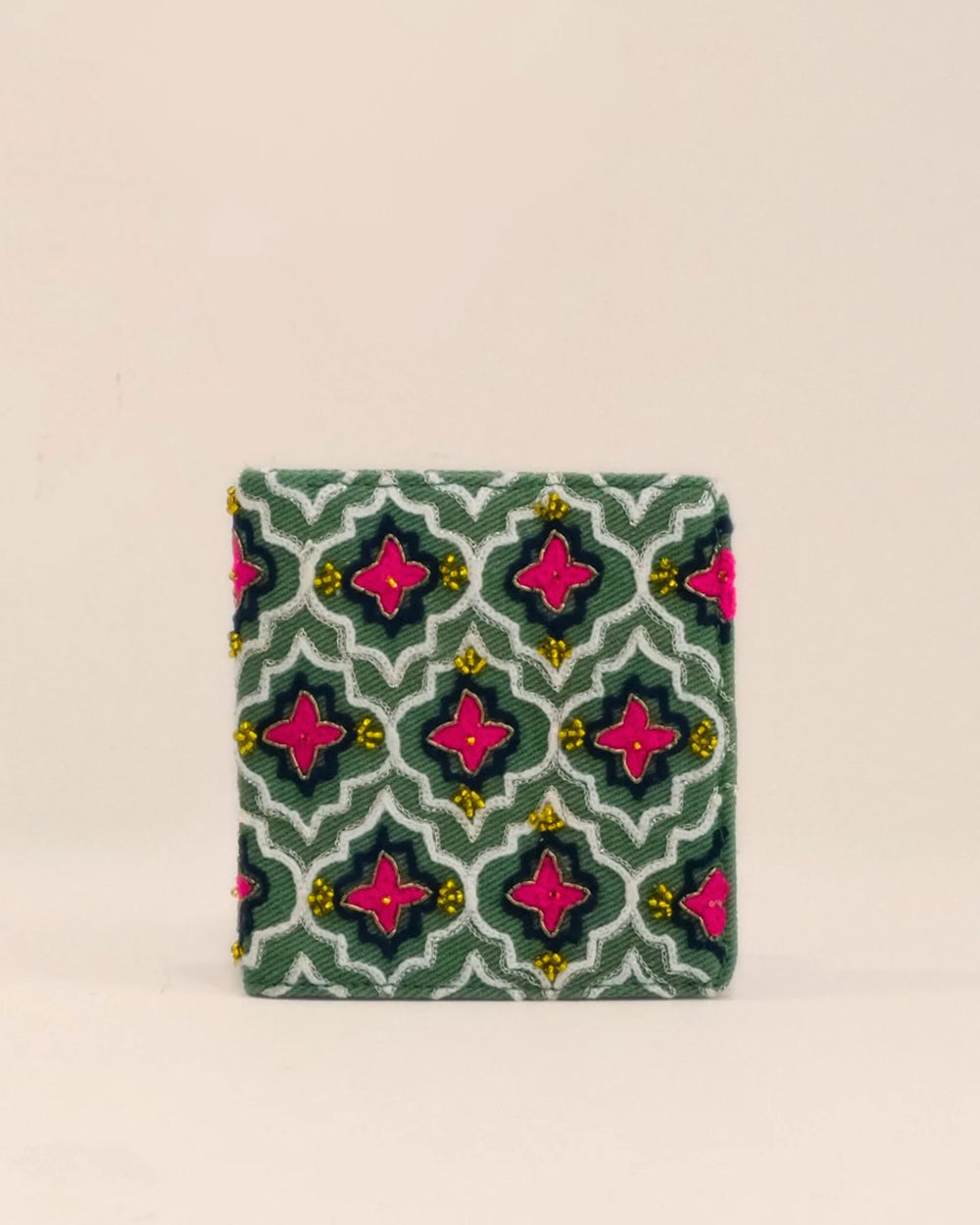 Small fabric pouch with a geometric pattern on a beige background