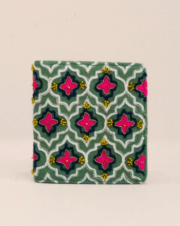 Small rectangular pouch with a geometric pattern on a beige background