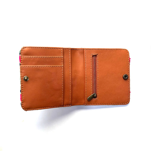Brown leather wallet with a zipper on a white background