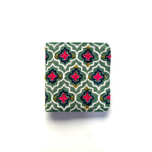 Small rectangular pouch with a colorful geometric pattern on a white background
