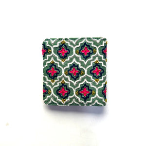 Small fabric square with a geometric pattern on a white background