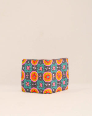 Colorful patterned pouch on a beige background