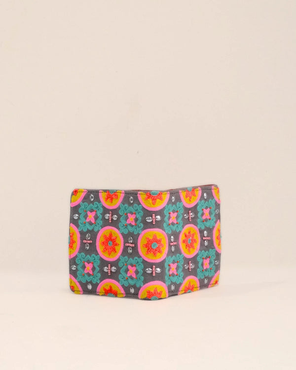 Colorful patterned pouch on a beige background
