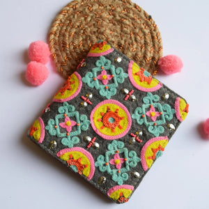 Decorative pouch with colorful patterns on a white background
