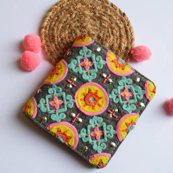 Decorative pouch with colorful patterns on a white background