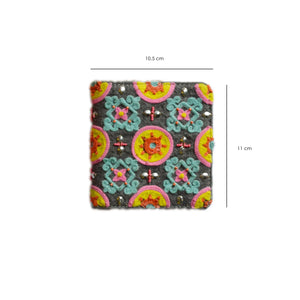 Colorful patterned fabric square with measurements on a white background