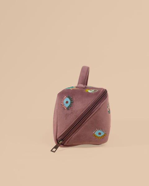 Travel-friendly vanity pouch in brown with embroidery designs