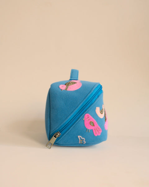 Durable fabric makeup pouch with pink and gold embroidered bird motifs, lightweight and chic design.