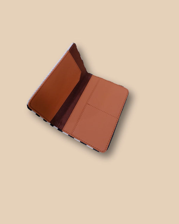 Stylish passport cover for travelers with compact striped design.
