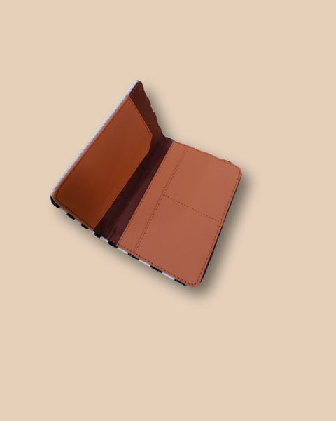 Stylish passport cover for travelers with compact striped design.