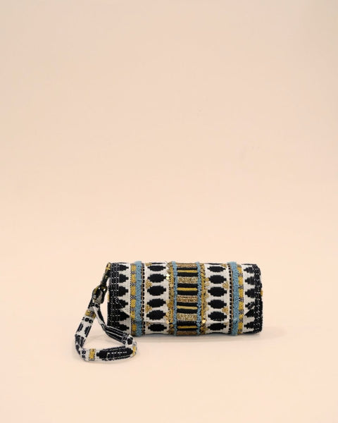 Handmade sunglass cover with tribal-inspired embroidery in black, white, gold, and blue, featuring secure strap handle.