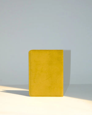 Yellow notebook on a light gray background